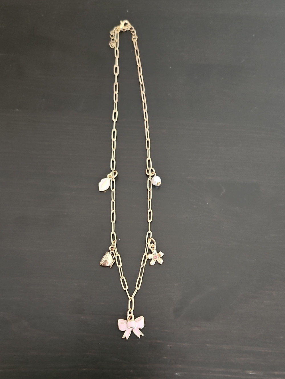 Source Unknown Gold Tone Necklace with Pink Enamel Bow and Mixed Charms
